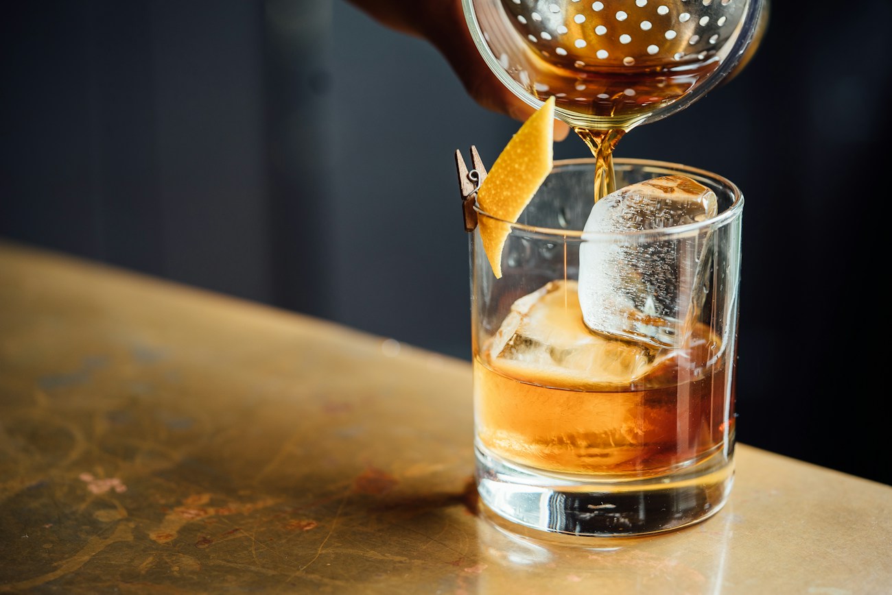 Drinks arranged in a softly lit lounge setting